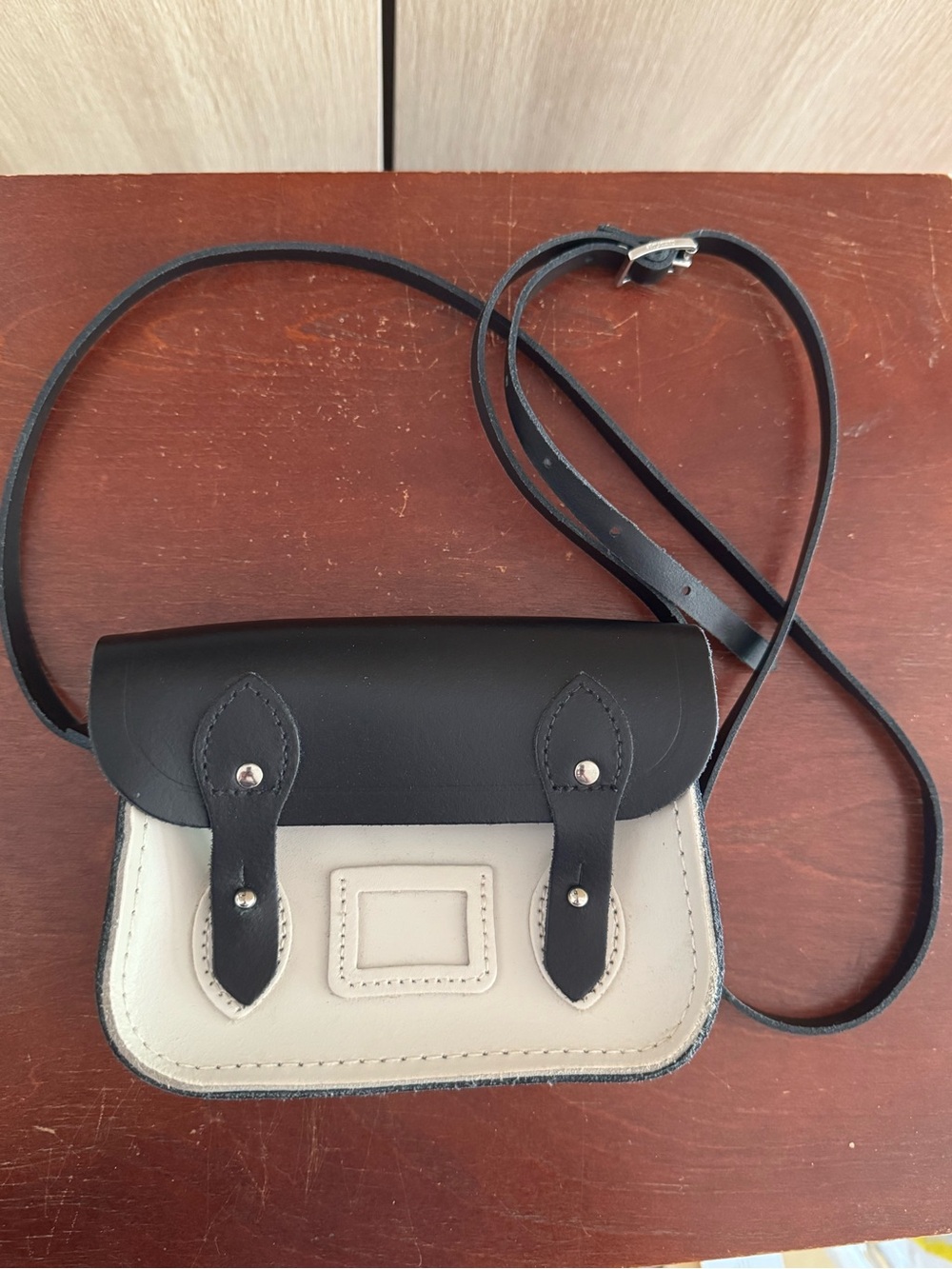 The Cambridge Satchel Company mini black and white crossbody leather handbag